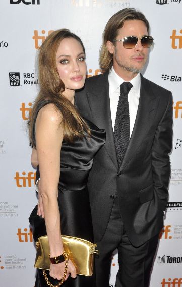 Angelina Jolie in her Louis Vuitton handcuff clutch.