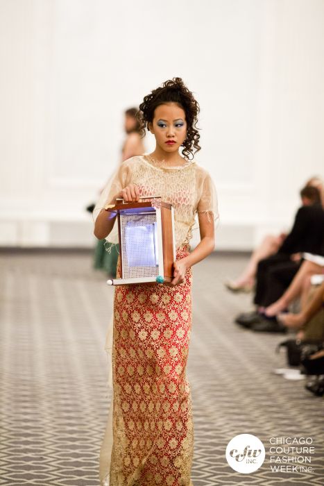 An Asian Royalty in a j-na couture cultural fusion with a Corso Light Sculpture. Runway Inspiration.