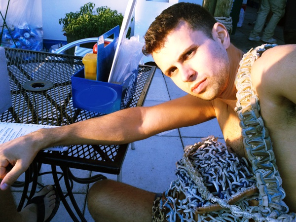 Cal and his custom couture manbag at the North Ave Beach ouse.