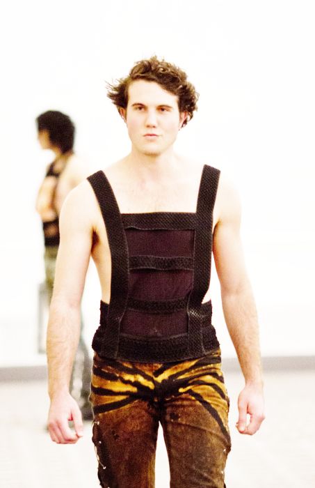 Shapewear in a tank top that cinches in love handles and exposes skin in the most flattering manly areas.