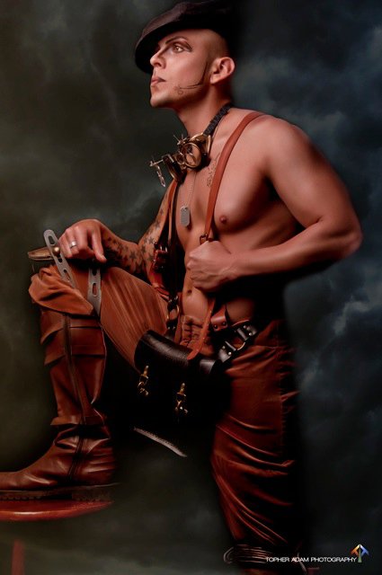 Danish steampunk designer with rubber suspenders and messenger bag. Danish steampunk designer with rubber suspenders and messenger bag.